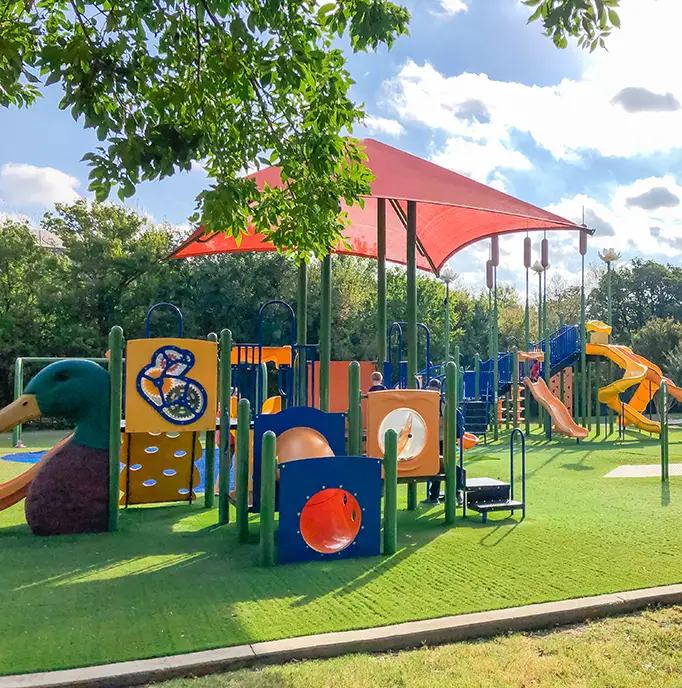Artificial grass playground installed by Teserra Outdoors