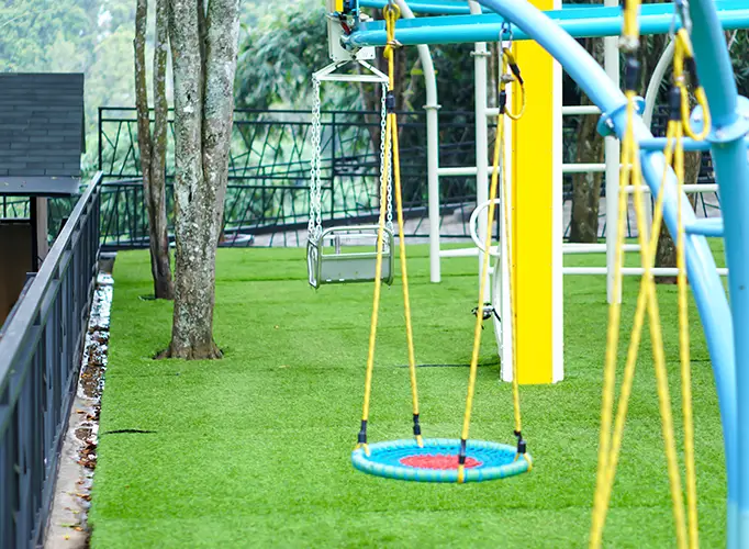 Artificial grass playground installed by Teserra Outdoors