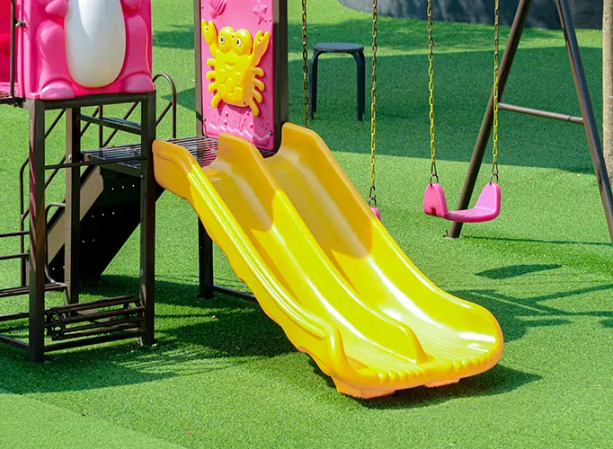 Artificial grass playground installed by Teserra Outdoors