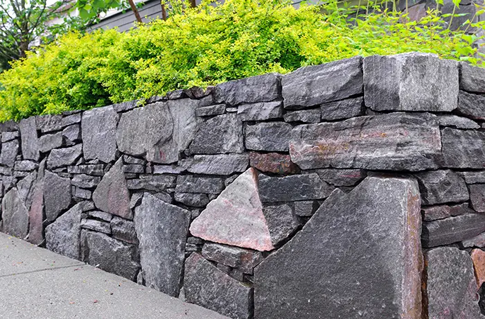 Outdoor retaining wall installation from Teserra Outdoors
